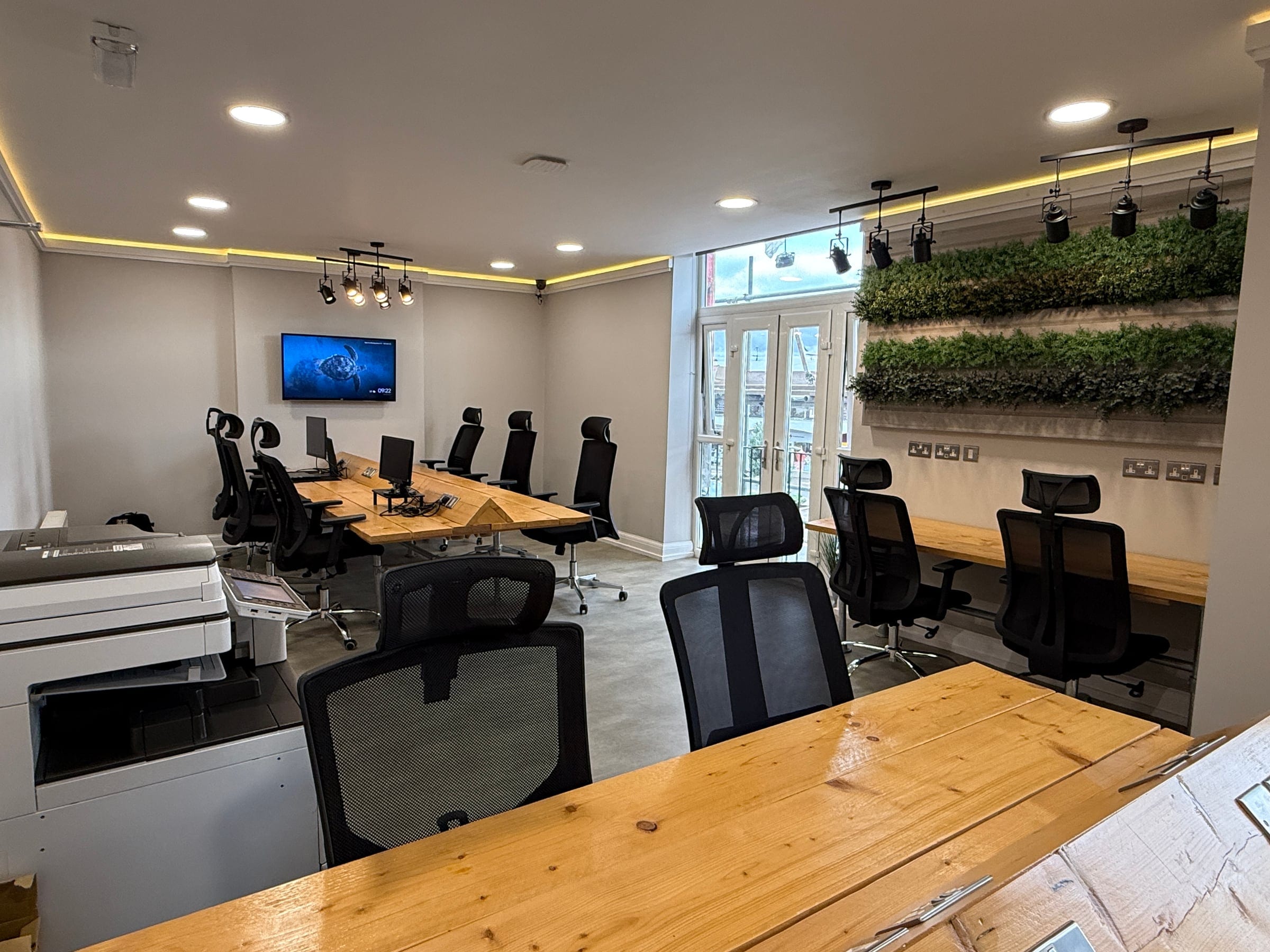 The boardroom at ShiftWorks Market Street, Hoylake, looking towards the living wall
